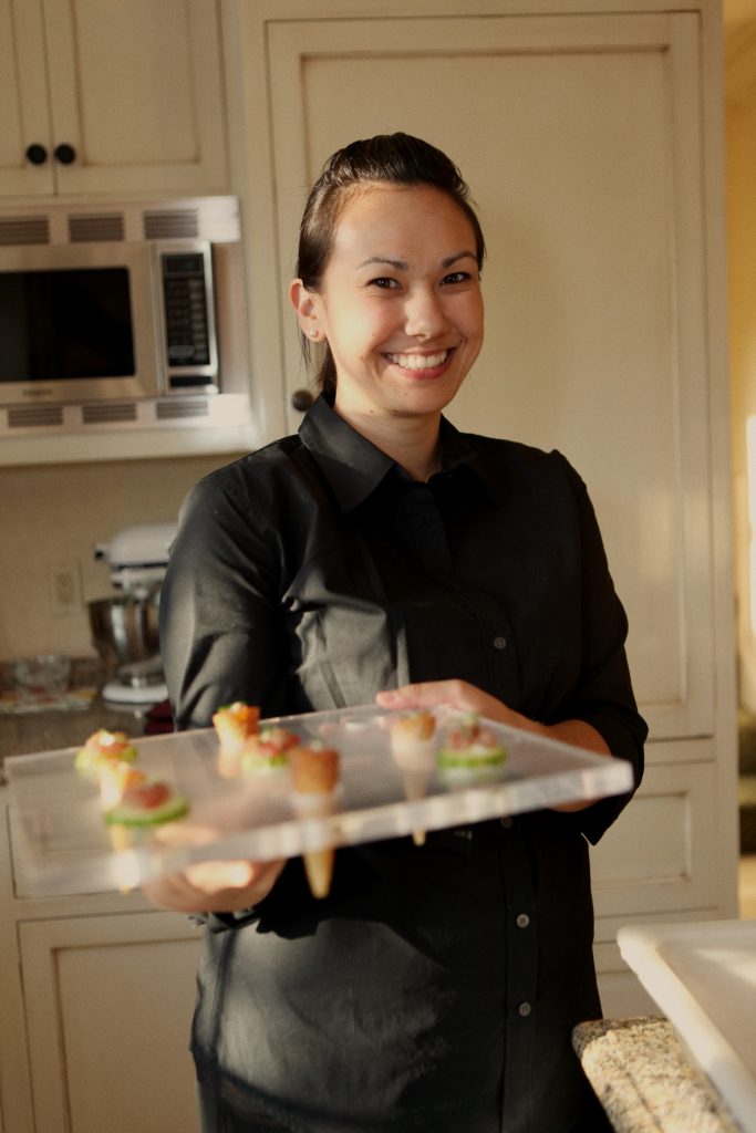 server holding tray of hors d'oeuvres
