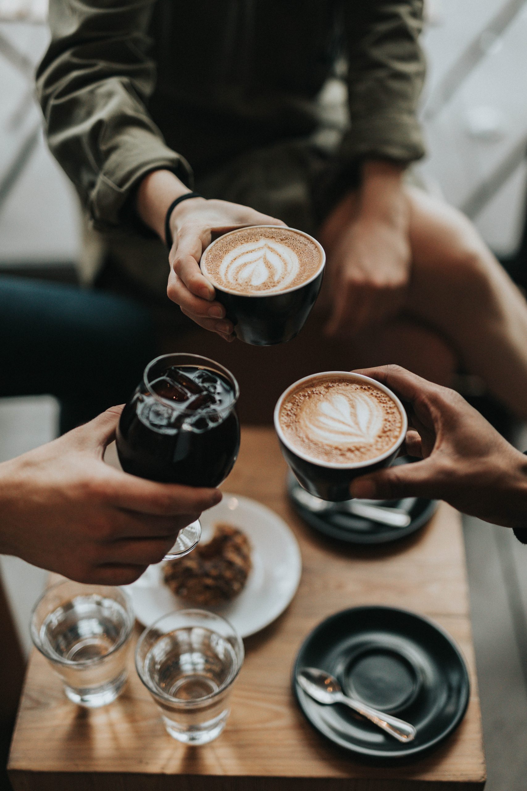 people cheering with coffee