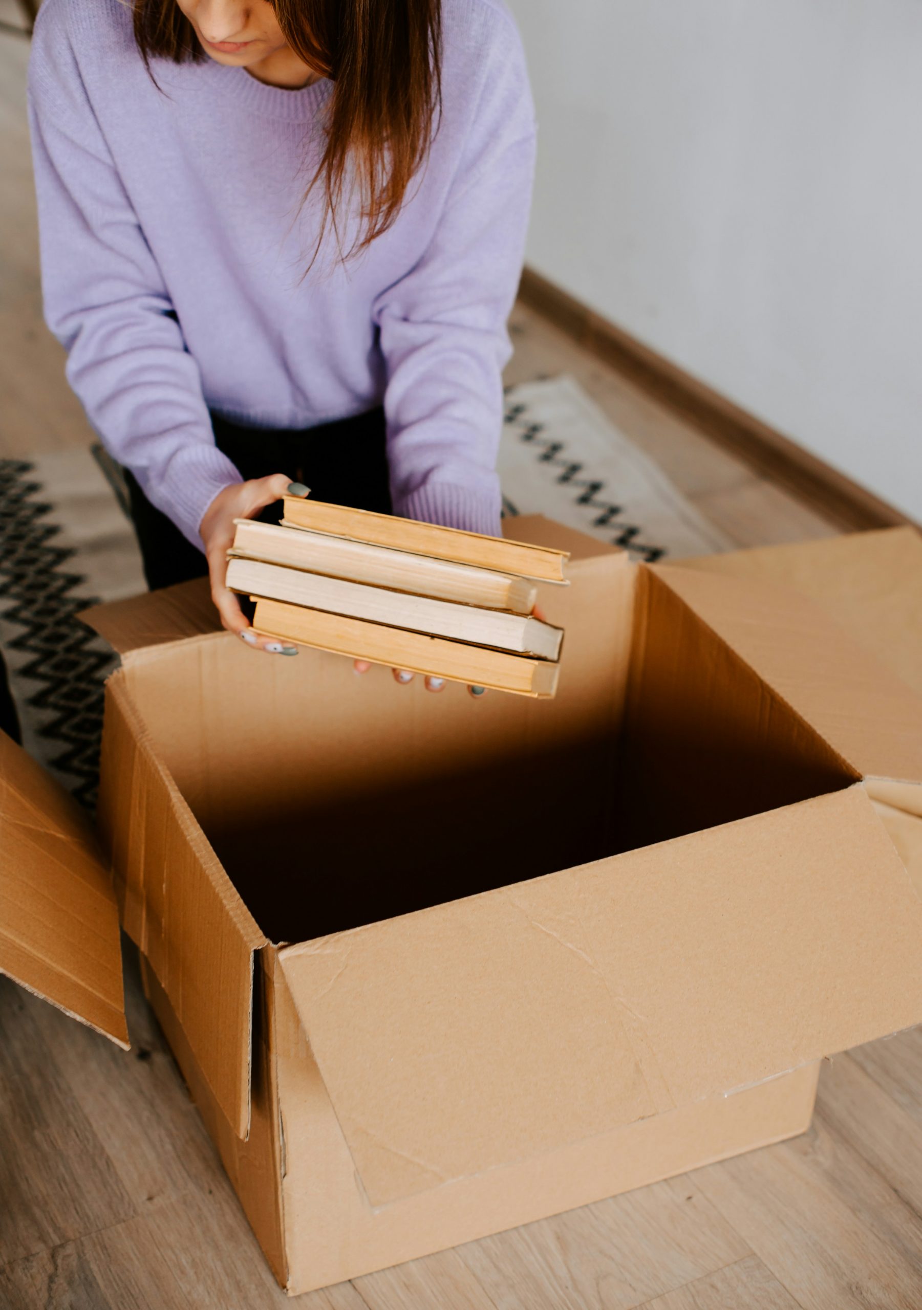 sorting and packing boxes, the dimaggio betta group connects their clients with packers, movers and more