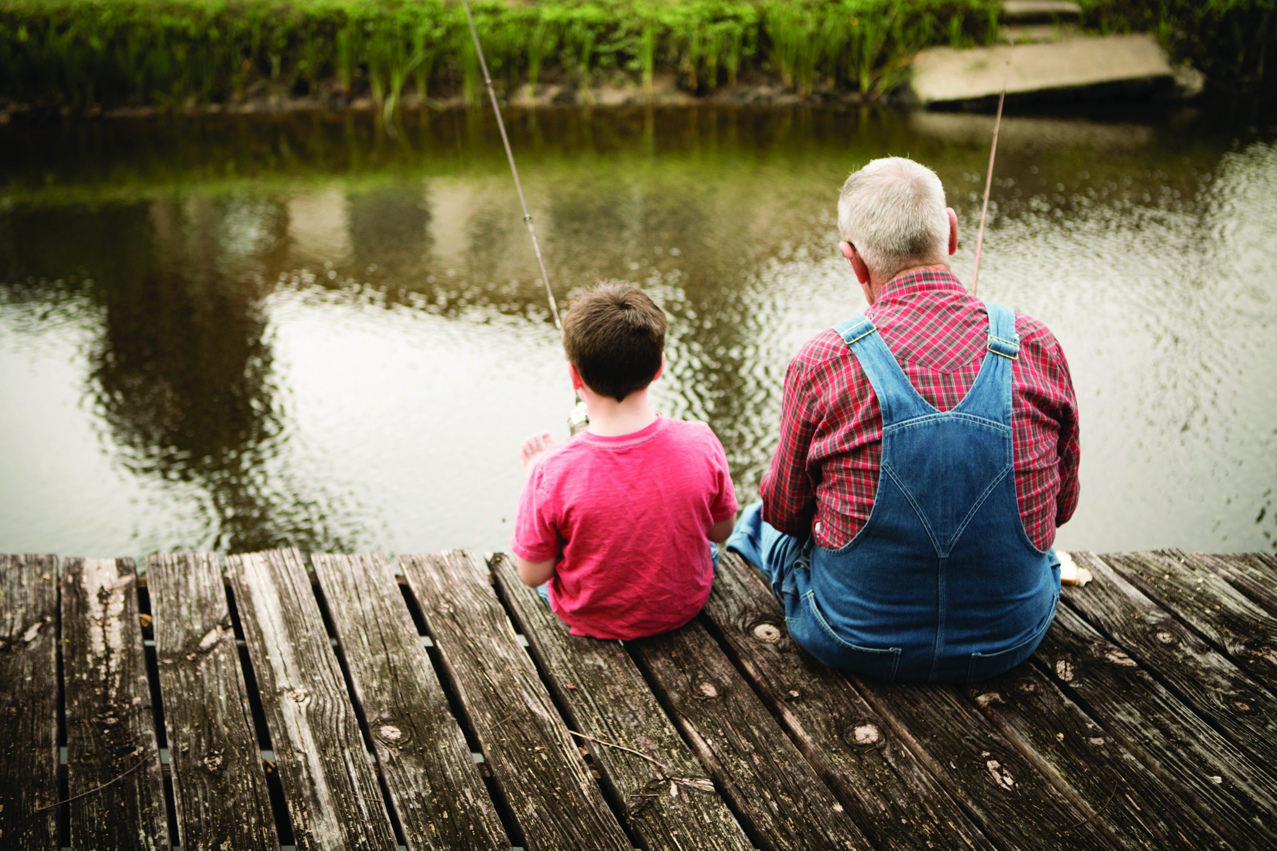 grandson and grandfather fishing